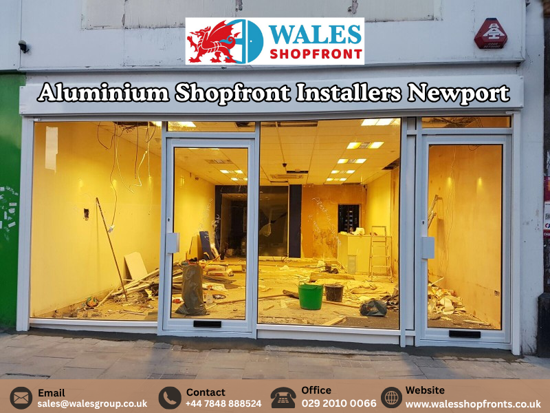 Aluminium shopfront installers fitting a commercial glass frontage