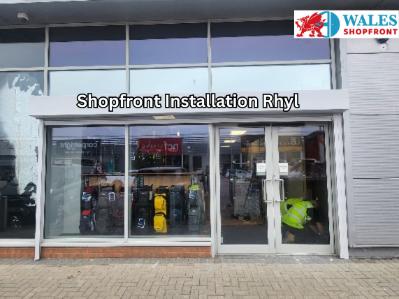 Commercial shopfront installation in Rhyl showing aluminium framing and glass entrance panels.