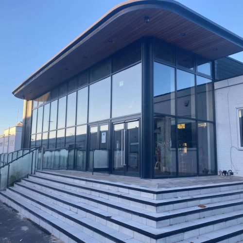 aluminium curtain wall system installed in commercial property Wales